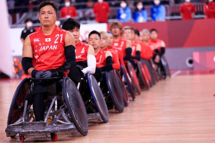 A close-up image of a male wheelchair rugby players
